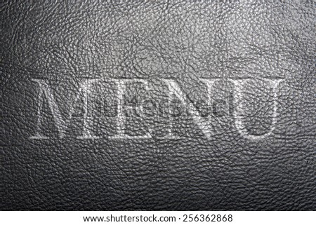 Texture of the leather black with embossed letters: Menu