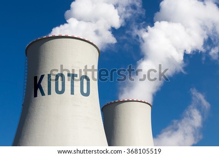 Industrial exhaust pipe with inscription KIOTO against the sky and smoke