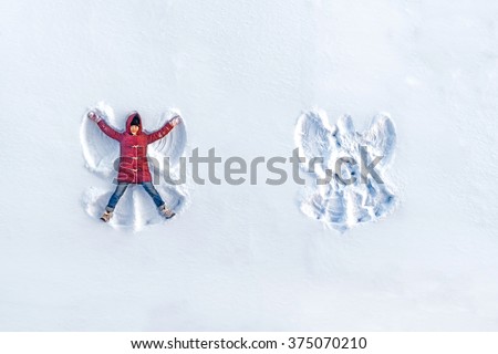 The girl on a snow angel shows