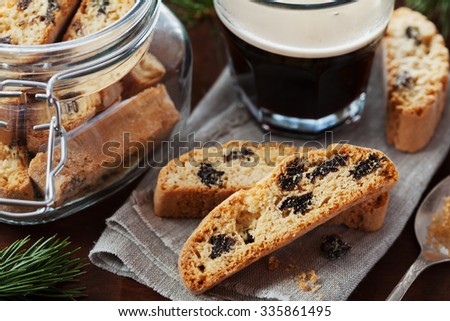 Coffee with biscotti or cantucci on wooden vintage table, traditional Italian biscuit or cookie