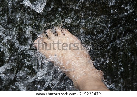 foot in cold water flow.