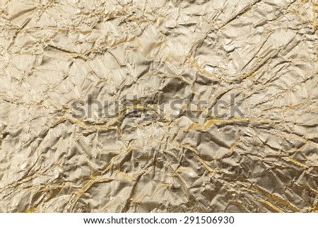 Crumpled gold paper background.