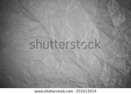 Gray crumpled paper recycling background.