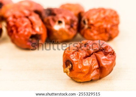 Close up and selective focus on the dried Chinese Red Dates at the foreground