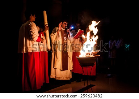 KUALA LUMPUR, April 19, 2014:  Catholics celebrated Easter eve mid-night mass at Church of St. Thomas More in Malaysia. The priest lighted up the new fire on the Paschal Candle as part of the ritual.