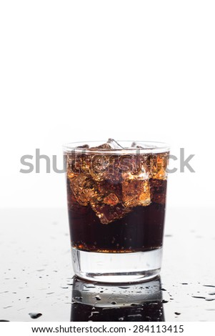 A glass of refreshing cold fizzy cola drinks on vertical format