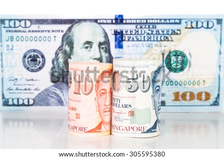 Close up of Singapore Dollar currency note against US Dollar.