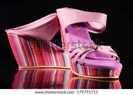 women leather shoes. purple color. fancy shoe sole in all rainbow colors. isolated on black background