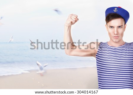 young handsome sailor in the background of the sea