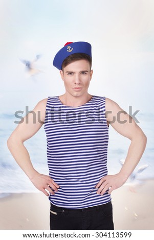 young handsome sailor in the background of the sea