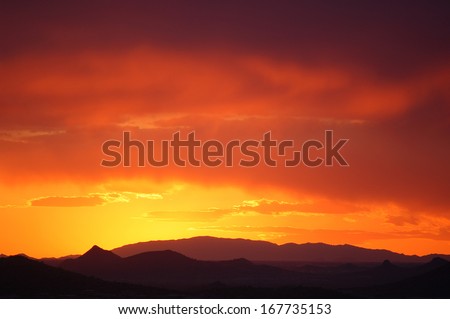 Desert sunset with bright color gradients