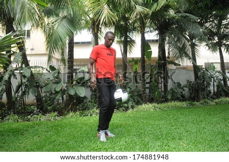 RIO DE JANEIRO, BRAZIL - OCTOBER 24, 2012: Jamaican sprinter Usain Bolt on his visit to Rio try few soccer moves in the hotel garden.