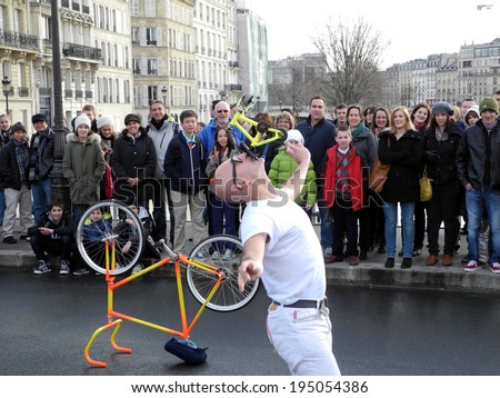 PARIS, FRANCE - APRIL 20, 2014: A street performer performing for tourists on a Paris street