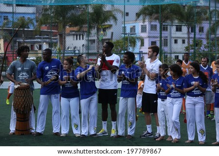 Rio de Janeiro, Brazil June 9, 2014 - Players of the English national football team, visit the community of Rocinha and play Capoeira with the locals. No Use in Brazil.