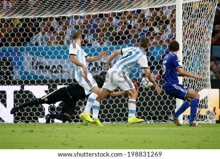 RIO DE JANEIRO, BRAZIL - June 15, 2014: CAMPAGNARO (2nd R) and LULIC (R) watch the ball at world cup Group F game between Argentina and Bosnia at Maracana Stadium. No Use in Brazil.