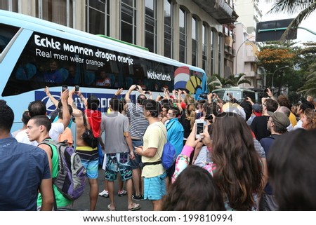 RIO DE JANEIRO, BRAZIL -  May 20, 2014: Fans gather at the bus for the Netherlands national soccer team who begin training in preparation for the 2014 World Cup soccer tournament, which begins in June 12. No Use In Brazil.