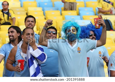 RIO DE JANEIRO, BRAZIL - June 28, 2014: soccer fans celebrating at the 2014 World Cup Round of 16 game between Colombia and Uruguay at Maracana Stadium. No Use in Brazil.