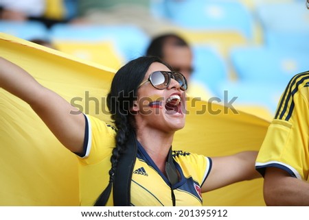 RIO DE JANEIRO, BRAZIL - June 28, 2014: soccer fans celebrating at the 2014 World Cup Round of 16 game between Colombia and Uruguay at Maracana Stadium. No Use in Brazil.
