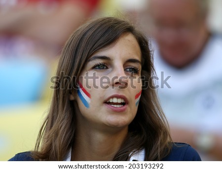 RIO DE JANEIRO, BRAZIL - July 04, 2014: Soccer fan of France during the World Cup Quarter-finals game between France and Germany at Maracana Stadium. No Use in Brazil.