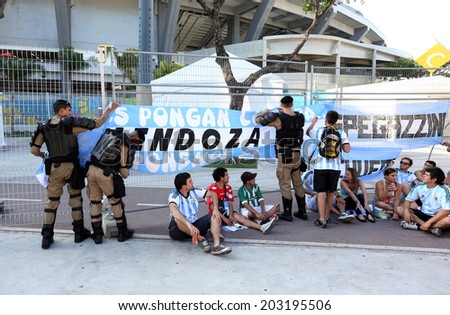 RIO DE JANEIRO, BRAZIL - June 15, 2014: Brazlian police takes off the Argentina supporting banners at the World Cup Group F game between Argentina and Bosnia at Maracana Stadium. No Use in Brazil.