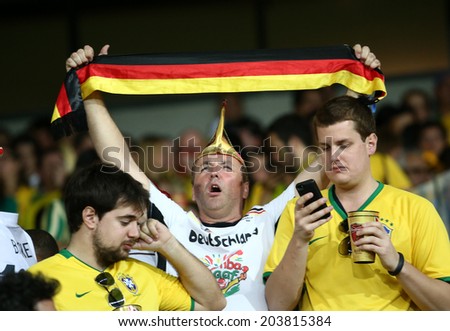 BELO HORIZONTE, BRAZIL - July 8, 2014: Soccer fans of Germany celebrate during the World Cup Semi-finals game between Brazil and Germany at Mineirao Stadium. NO USE IN BRAZIL.