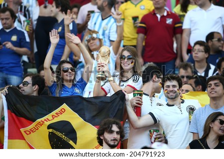RIO DE JANEIRO, BRAZIL - July 13, 2014: Soccer fans during the World Cup Final game between Argentina and Germany at Maracana Stadium. NO USE IN BRAZIL