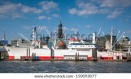 HAMBURG, GERMANY - MAY 1, 2013: Ships at Hamburg harbor on May 1st, 2013. Port of Hamburg is the second busiest in Europe. There are various museum ships, musical theaters, bars, restaurants and hotel