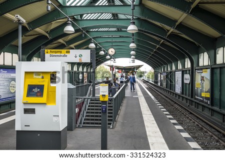 Berlin, Germany - June 27, 2015: Schonhauser Allee Platform of the Berlin East Railway station with a waiting travellers. The Berlin U-Bahn is the most extensive underground network in Germany