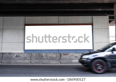 blank billboard with moving car passing by