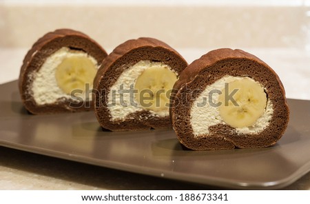 chocolate swiss roll cake with banana inside