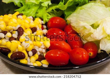 mixed salad with corn, tomatoes and salad green