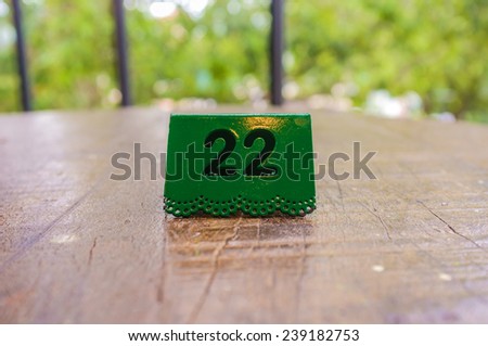 number plate placed in tabletop of restaurant