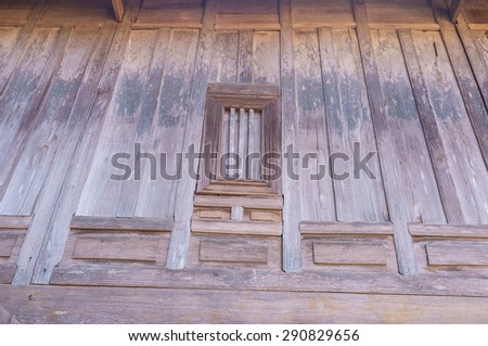 traditional Thai house made of raw wood