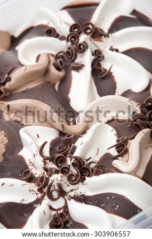 A box of ice cream with chocolate and hazelnuts.