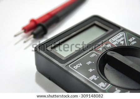 Multimeter instrument with wires on the white background.