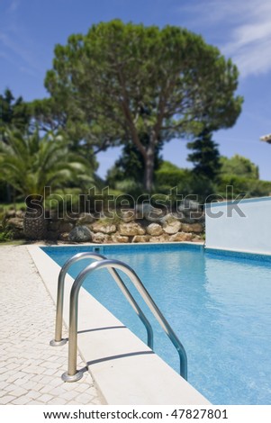 healthy garden and a refresh water pool at a villa (Algarve, south of Portugal)
