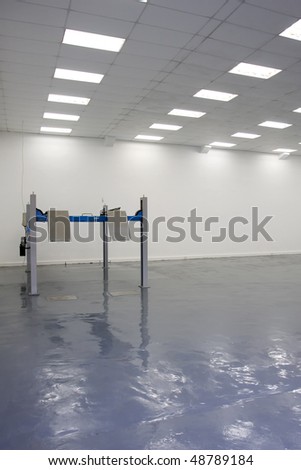 a single lift in car service garage with a blue floor ( equipment for diagnostics of car)