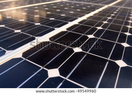 Texture detail of photoelectric cells of a solar panel (Blue and ecology energy). Photographed with shallow DOF