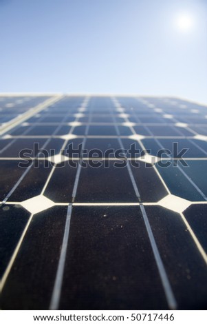 Texture detail of photoelectric cells of a solar panel (Blue and ecology energy). Photographed with shallow DOF