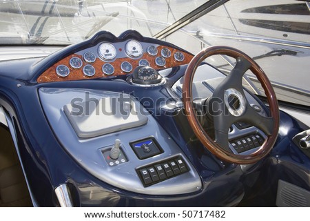 Instrument panel and steering wheel of a motor boat cockpit (yacht control bridge)