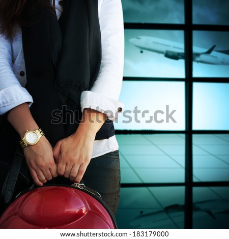 Woman with luggage in the airport