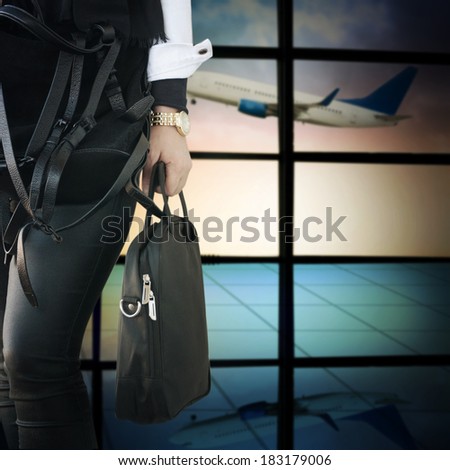 Woman with notebook bag in the airport