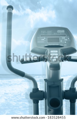 elliptical cross trainer in a row in a gym