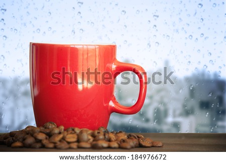 coffee cup on a rainy day window background