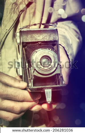 Photographer with vintage camera