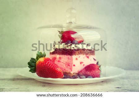 Cake in a glass bell jar