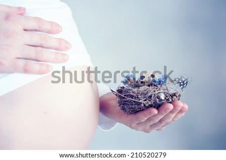 Pregnant woman with nest