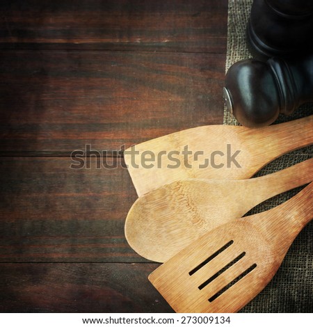 Serving spoons on  wooden surface