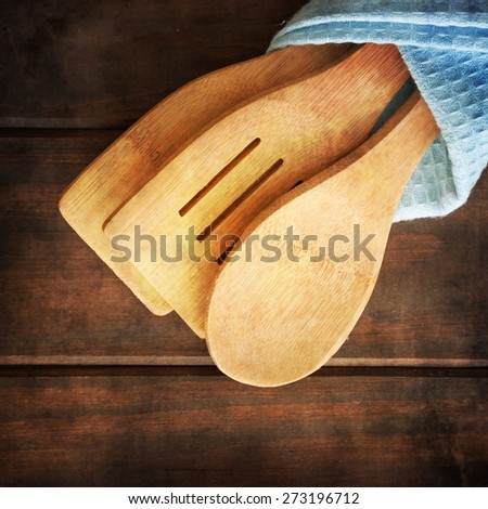 Serving spoons on  wooden surface