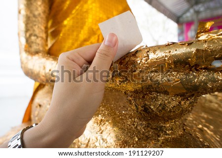 Thai tradition cover statue of Buddha with gold leaf